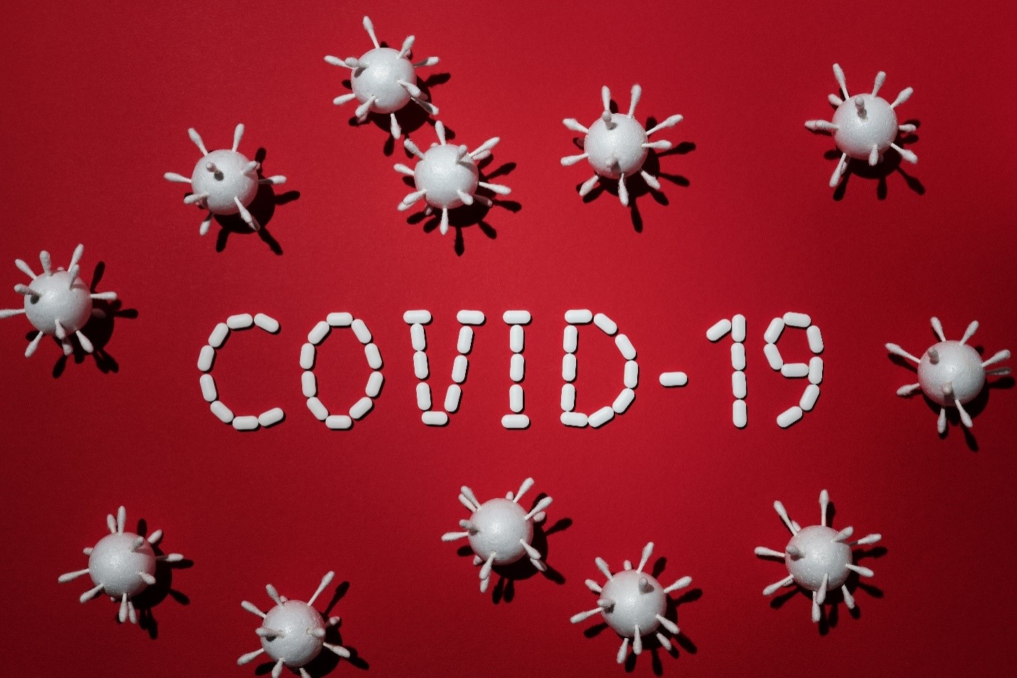 covid-19 graphic surrounded by virus